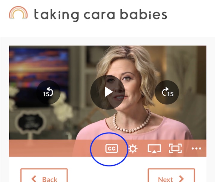 The CC button located on the mobile video player in a menu positioned after the video progress scrubbing control